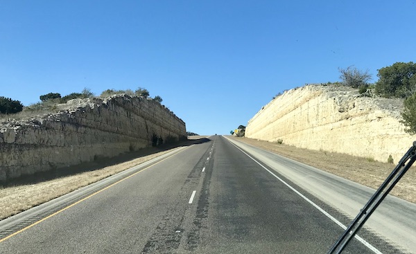 Highway goes through mountain pass on the way to Sonora Texas