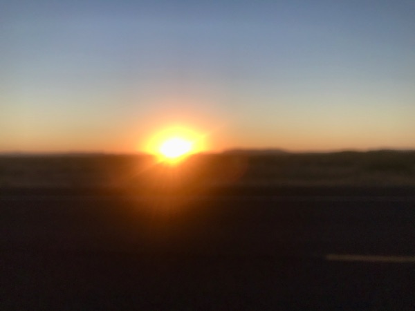 The sun setting behind a mountain at Terlingua Ranch Texas