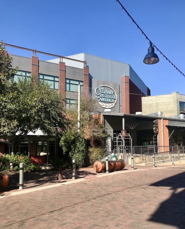 a modern building that houses The Culinary Institute of America in The Pearl in San Antonio