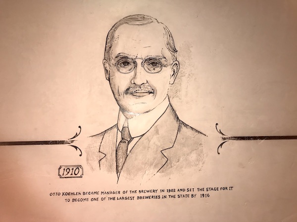 A drawing of a man with glasses and in a suit in The Pearl in San Antonio