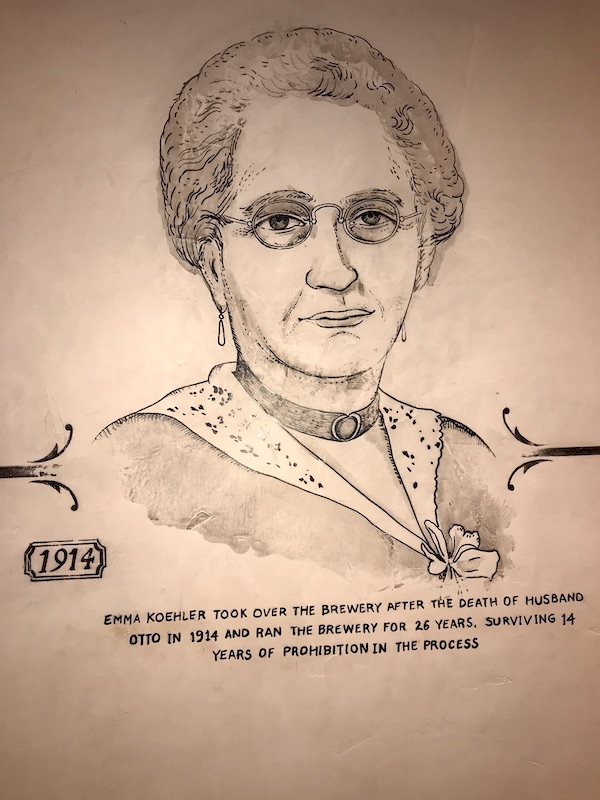 A drawing of a woman in a dress with glasses.