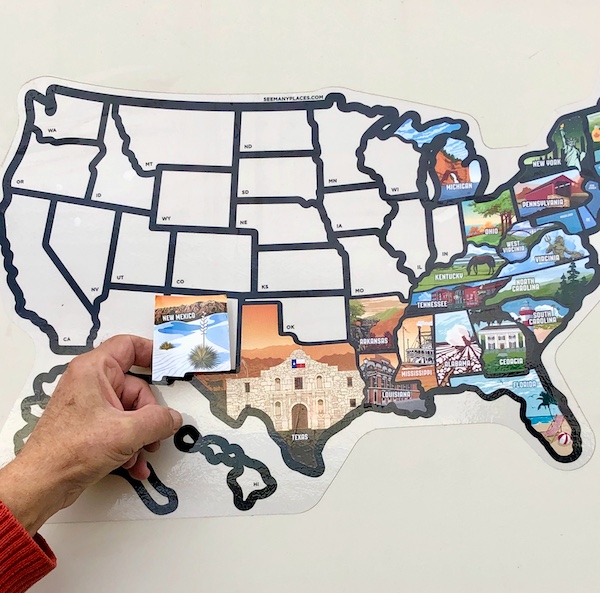 Aliens Abound in Roswell New Mexico and a New Mexico state sticker is being added to a map of an RV.