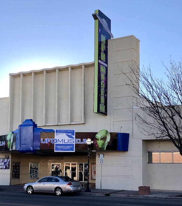 A white building with a marquis that says UFO Museum is a place where Aliens Abound in Roswell New Mexico