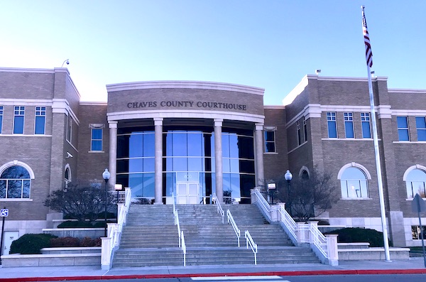 A brick building with lots of steps leading to the entrance in Roswell NM