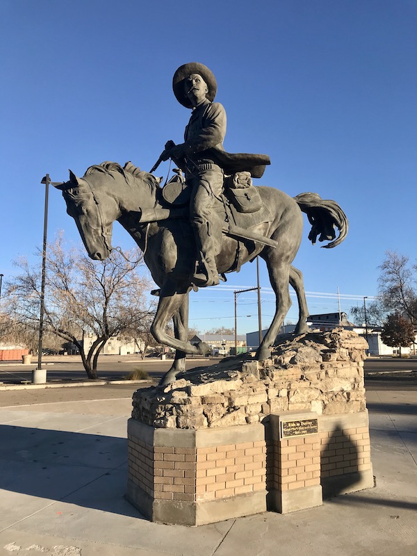 A bronze horse with rider sculpture in Roswell NM