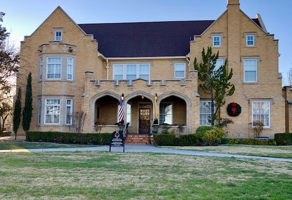 A large brick house is the headquarters for the NM Military Institute where Aliens Abound in Roswell New Mexico