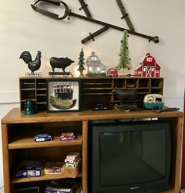 A small wood cabinet with objects on display where Aliens Abound in Roswell New Mexico