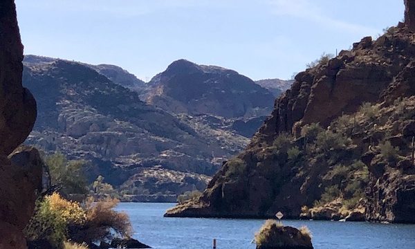 A large lake surrounded by mountains and blue sky with wispy clouds along the #Locavores #WeLoveFood #RestaurantOwner #Foodies #Chef #FoodTruck #Cafe #Bistro #Eatery #TheTravelingLocavores #Recipes #FoodStories #Cooking #Wanderlust #Traveling