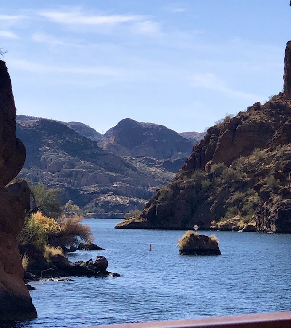 A large lake surrounded by mountains and blue sky with wispy clouds along the #Locavores #WeLoveFood #RestaurantOwner #Foodies #Chef #FoodTruck #Cafe #Bistro #Eatery #TheTravelingLocavores #Recipes #FoodStories #Cooking #Wanderlust #Traveling