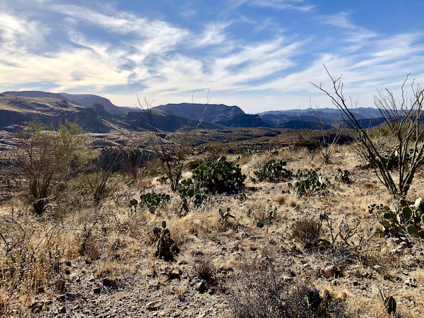 Desert landscape with mountains and white clouds in the sky along the Apache Trail Arizona