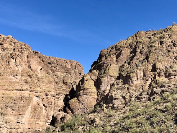 Craggy rocks forming mountains set against blue sky along the Apache Trail Arizona