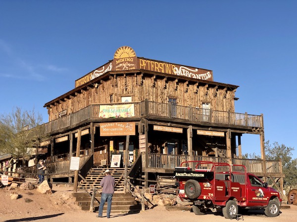 A large brown wood stucture is a general store along the Apache Trail Arizona