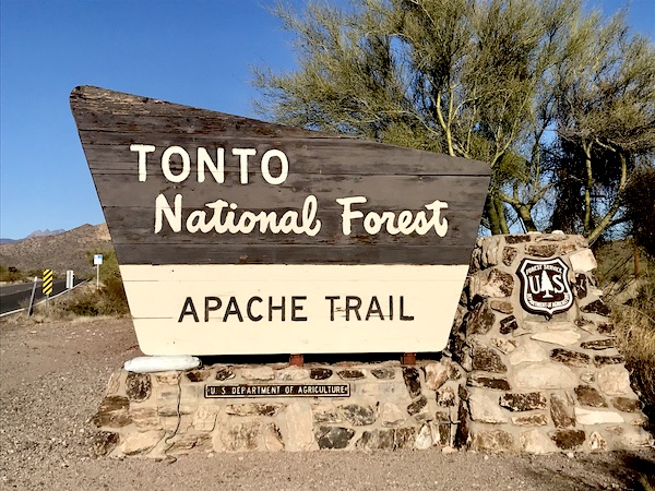 A brown and beige sign letting you know you are entering the Tonto National Forest, Apache Trail Arizona
