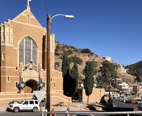 A mission style beige brick church building in Bisbee Tombstone and Boot Hill in Arizona