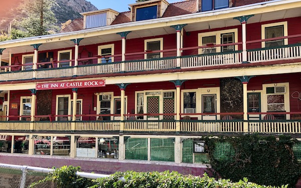 A large red hotel building is an Inn in Bisbee Tombstone and Boot Hill in Arizona
