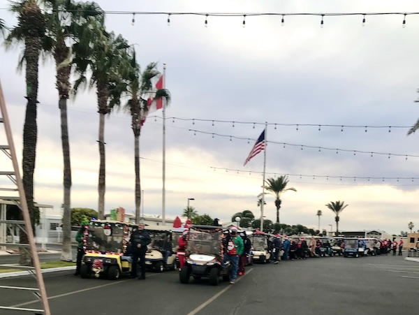 A line up of golf carts decorated for Christmas at Mesa Regal RV Resort
