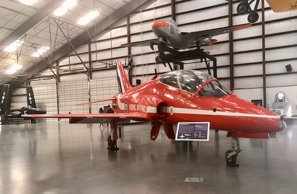 A small bright red airplane belonging to the Royal Airforce at the Pima Air and Space Museum