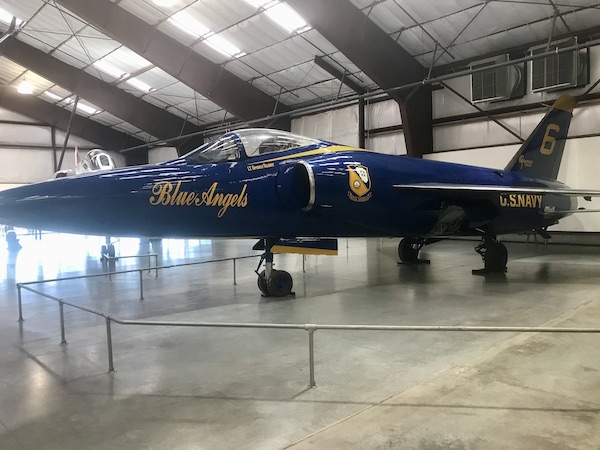 A blue jet with Blue Angels in gold lettering at the Pima Air and Space Museum