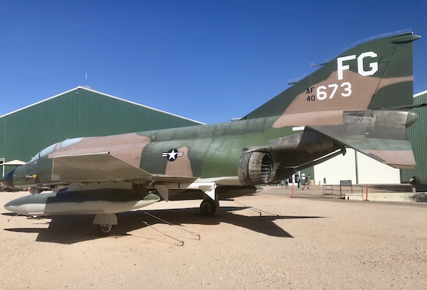 A large fighter jet painted in camouflage at the Pima Air and Space Museum