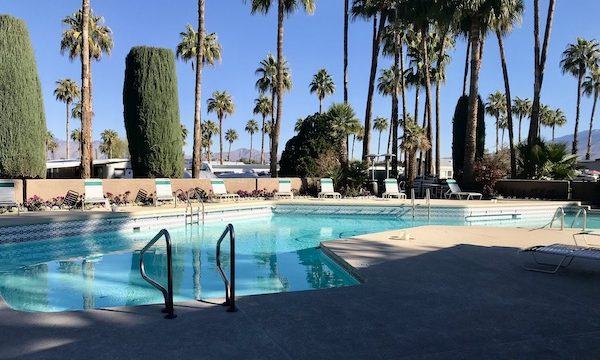 A large pool with tropical landscaping at Rincon Country East RV Resort Tucson AZ