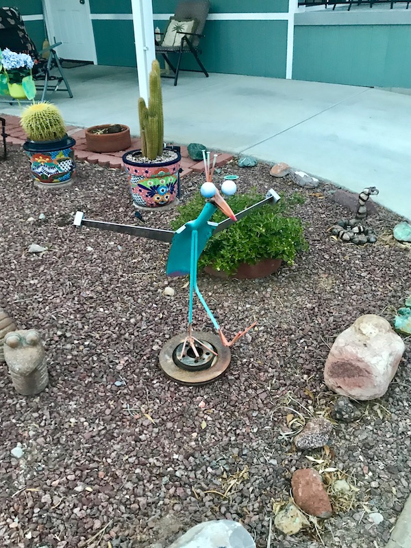 A garden with fun trinkets scattered at Rincon Country East RV Resort Tucson AZ