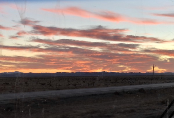 A blue sky with purple and pink clouds along the highway to Rincon Country East RV Resort Tucson AZ