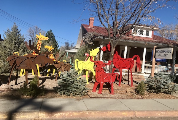Bright red and yellow animal sculptures at a gallery we passed on our drive Santa Fe to Albuquerque New Mexico