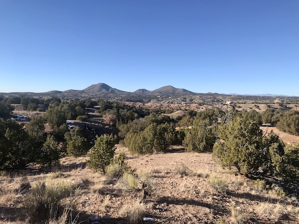 Mountains and bushes make for a scenic route from Santa Fe to Albuquerque New Mexico