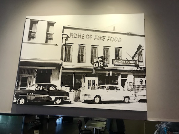 A black and white photo of a restaurant front with vintage cars in front on our trip from This is why you’ll find everything from blue corn green chile carne asada enchiladas with a warm pillowy sopaipilla to chicken fried steak with mashed potatoes and gyro with a Greek salad on the side.