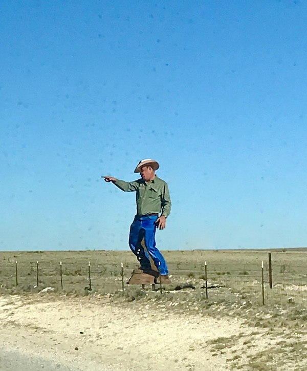 A cowboy realistic sculpture on the highway from Santa Fe to Albuquerque New Mexico
