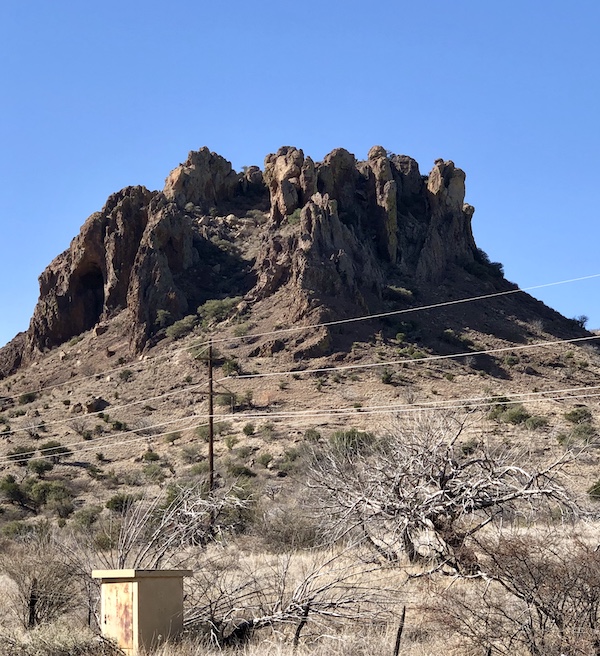 A mountain with craggy peak on our way to The Waterstop Marfa Texas
