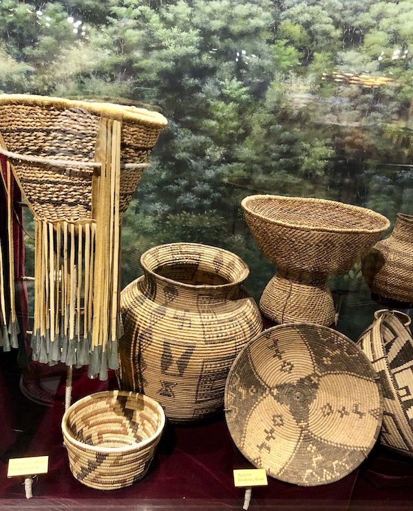 Several woven native American baskets on display at the Arizona Museum of Natural History