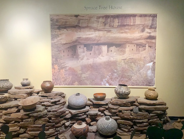 Multiple levels of rocks displaying native American pottery at the Arizona Museum of Natural History