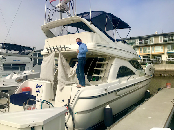 A sport fisherman style boat with a fly bridge near Beautiful Redlands California
