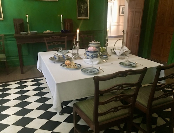 A dining room with black and white floor and square table en route Coast to Coast We Did It!