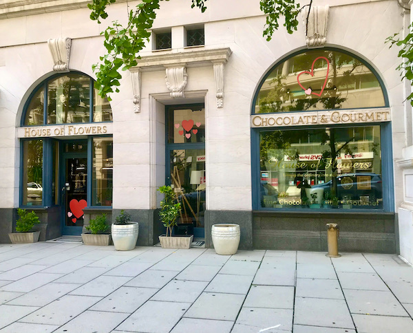 The front of a flower shop with arched windows en route Coast to Coast We Did It!