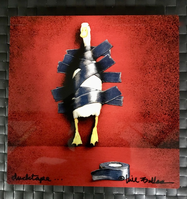 A piece of art showing a white duck taped to a red background with gray tape in Old Town Scottsdale Arizona