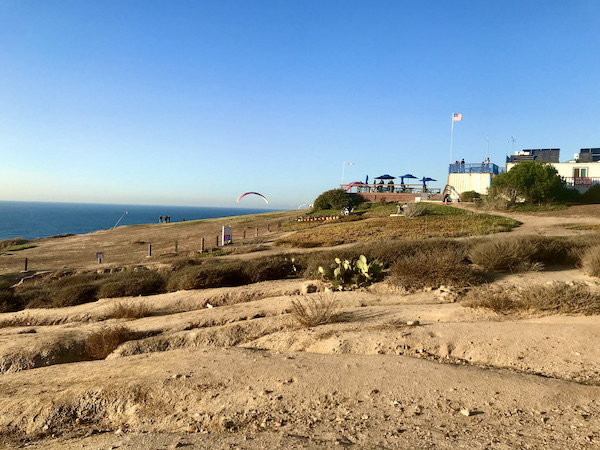 A beach, ocean and a park building in San Diego California