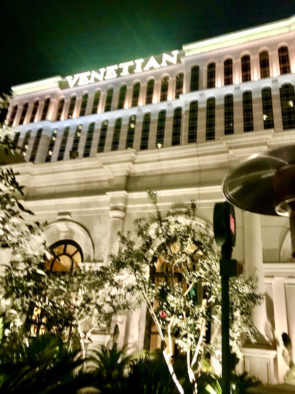 A large hotel with trees in front is home to Thomas Keller's Bouchon Las Vegas