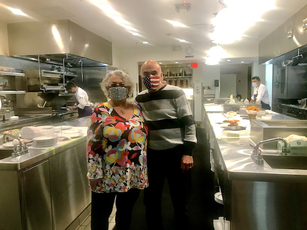 A man and a woman in Thomas Keller's Bouchon Las Vegas kitchen