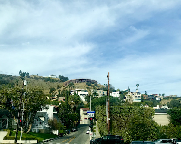 A mountainside with lots of houses seen during A Day in LaLa Land