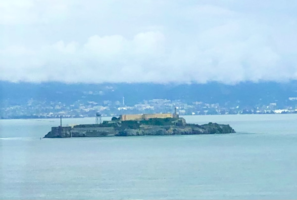 An island on the bay with a large prison building on it on our way for A Day with Friends in Windsor California