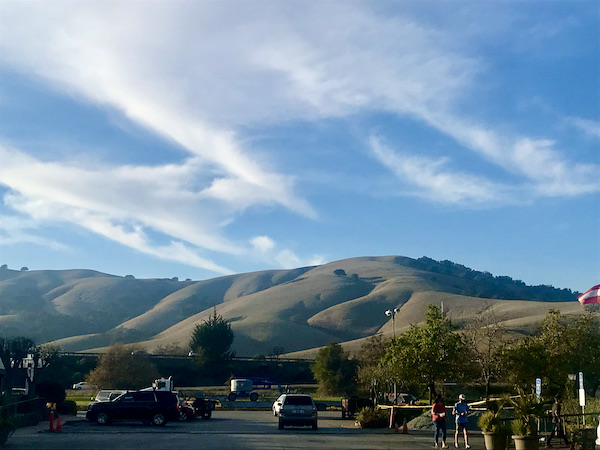 Beautiful mountains and blue sky with wispy clouds at Casa de Fruta Hollister California