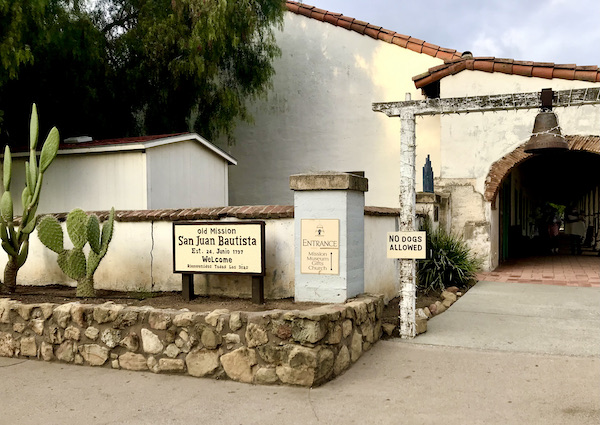 An old white Spanish church with barrel tile roof found while Exploring Hollister California and Beyond