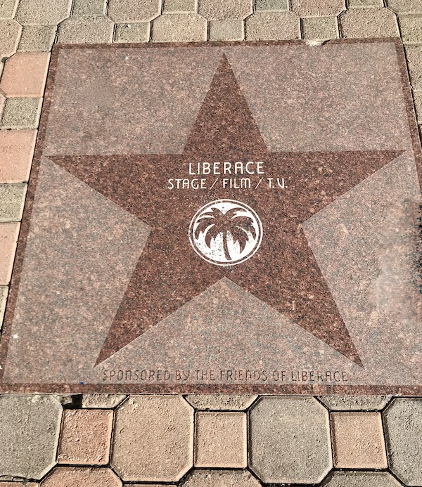 A pink marble square with a star in the center and a celebrity's name near Great Shakes in Palm Springs California