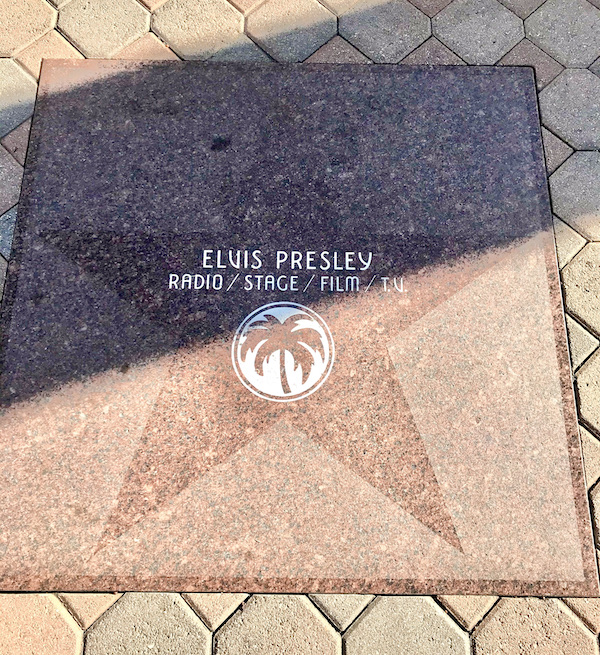A pink marble square with a star in the center and a celebrity's name near Great Shakes in Palm Springs California