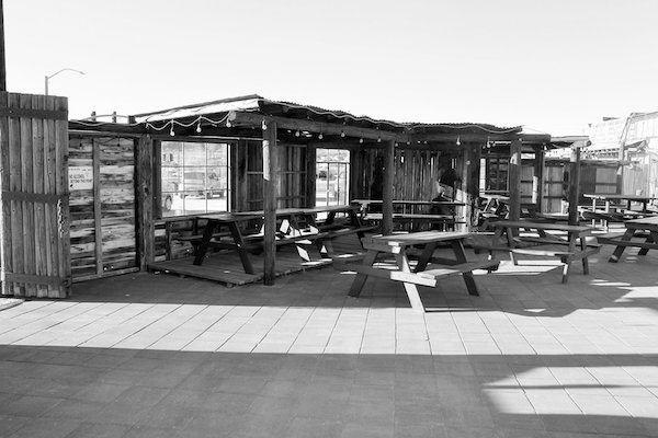 A wood building with lots of picnic benches near Joshua Tree National Park