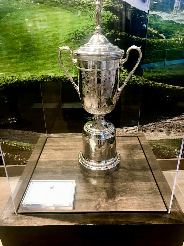 A large silver trophy in a glass case along the Scenic 17-mile Drive Monterey California