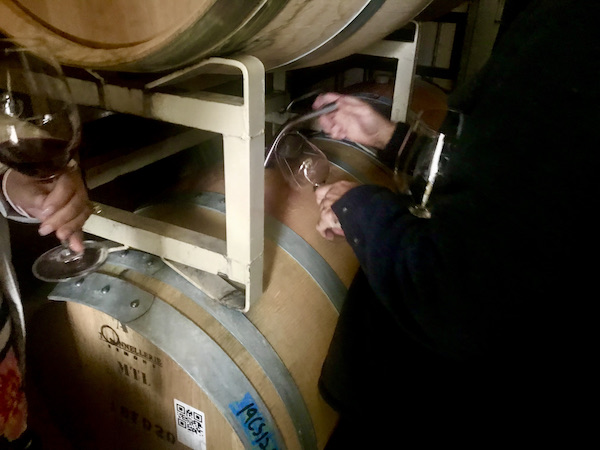 A wood wine barrel being tapped during our Behind the Scenes at Stuhlmuller Vineyards
