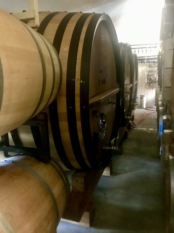 Stacks of wood barrels seen close up on our tour Behind the Scenes at Stuhlmuller Vineyards